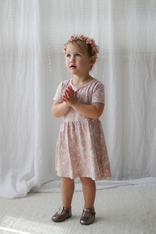 Our Cap Sleeve dress is everything you would hope for (and more) in an easy wear summer dress for your little Lady.  Featuring the cap sleeve for extra sun coverage and cuteness, its made from our organic cotton (95%) and elastane (5%) so its nice and cool with a little bit of stretch.  Our new Botanichaos design is chaotic yet subtle in white on this dress with the dusty rose fabric base. Available in size 1 right up to size 6.