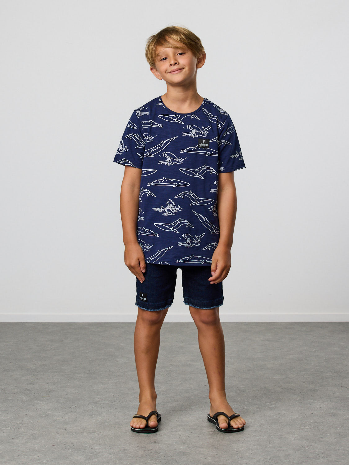 Radicool Kids Brydes's tee: Cotton / spandex tee in navy with Bryde’s whale outline yardage print in white. Part of our ‘Come Together’* series. For those that like something a little more pared back.    Fit is true to size.