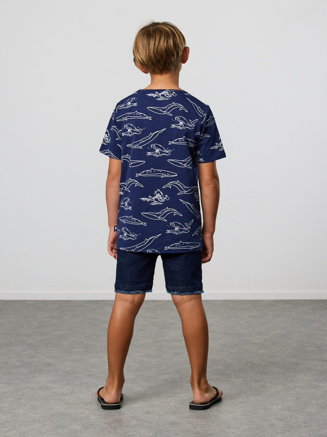 Radicool Kids Brydes's tee: Cotton / spandex tee in navy with Bryde’s whale outline yardage print in white. Part of our ‘Come Together’* series. For those that like something a little more pared back.    Fit is true to size.