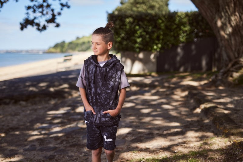 Cotton / spandex terry sleeveless hood in black tie-dye. Radicool Dude badge on chest & bolt print in white on reverse shoulder. A great piece for layering on cooler days or throw on as is.  Fit is true to size.