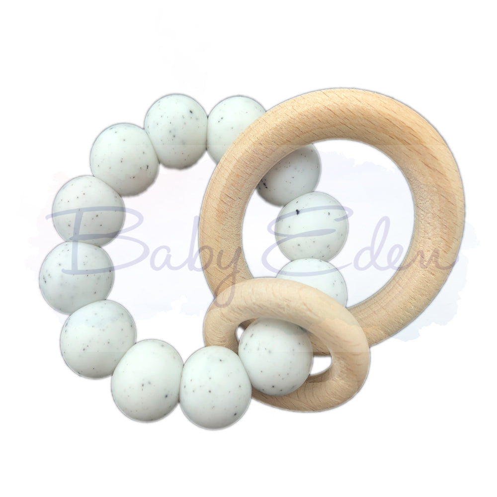 Speckled White Silicone & Wood Small Rattle at Baby Eden